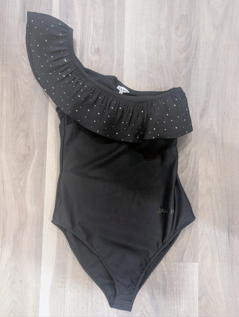 GANNI | Ruffled Rhinestone One-Shoulder Bodysuit In Black - Picture 3 of 11